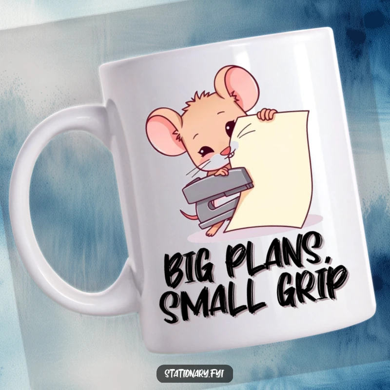 Funny mug showing a determined mouse struggling to staple enormous paper with a comically small stapler, embodying ambitious effort.