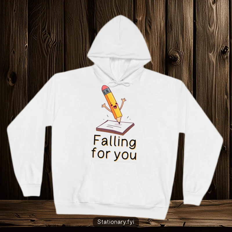 Funny pencil dramatically falling off a desk with flailing arms, depicted on a cozy hoodie.