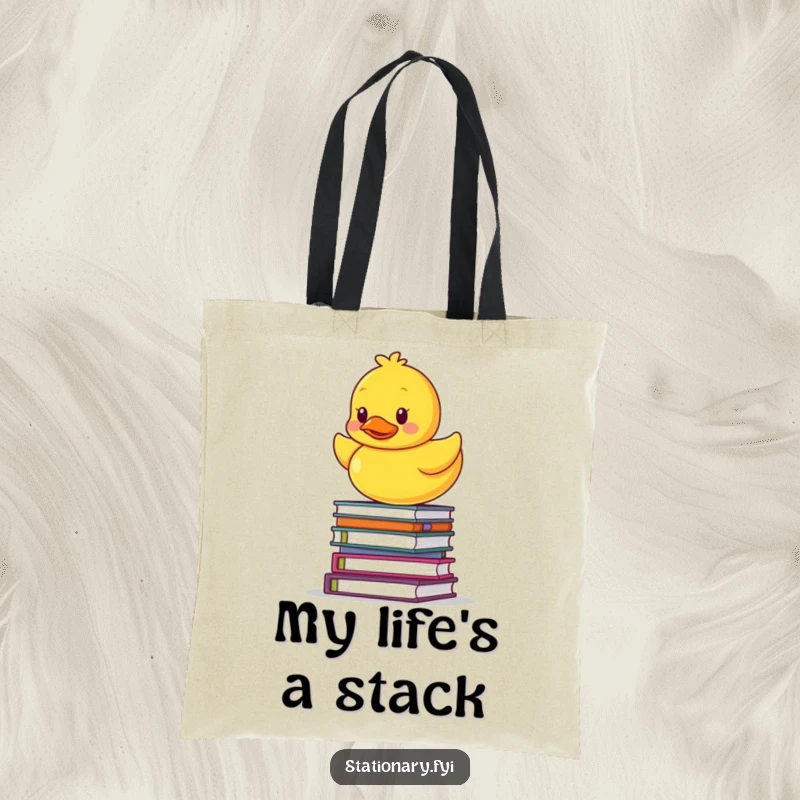 Funny tote bag featuring a rubber ducky wobbling on a stack of notebooks, symbolizing academic pursuits or life's balancing act.